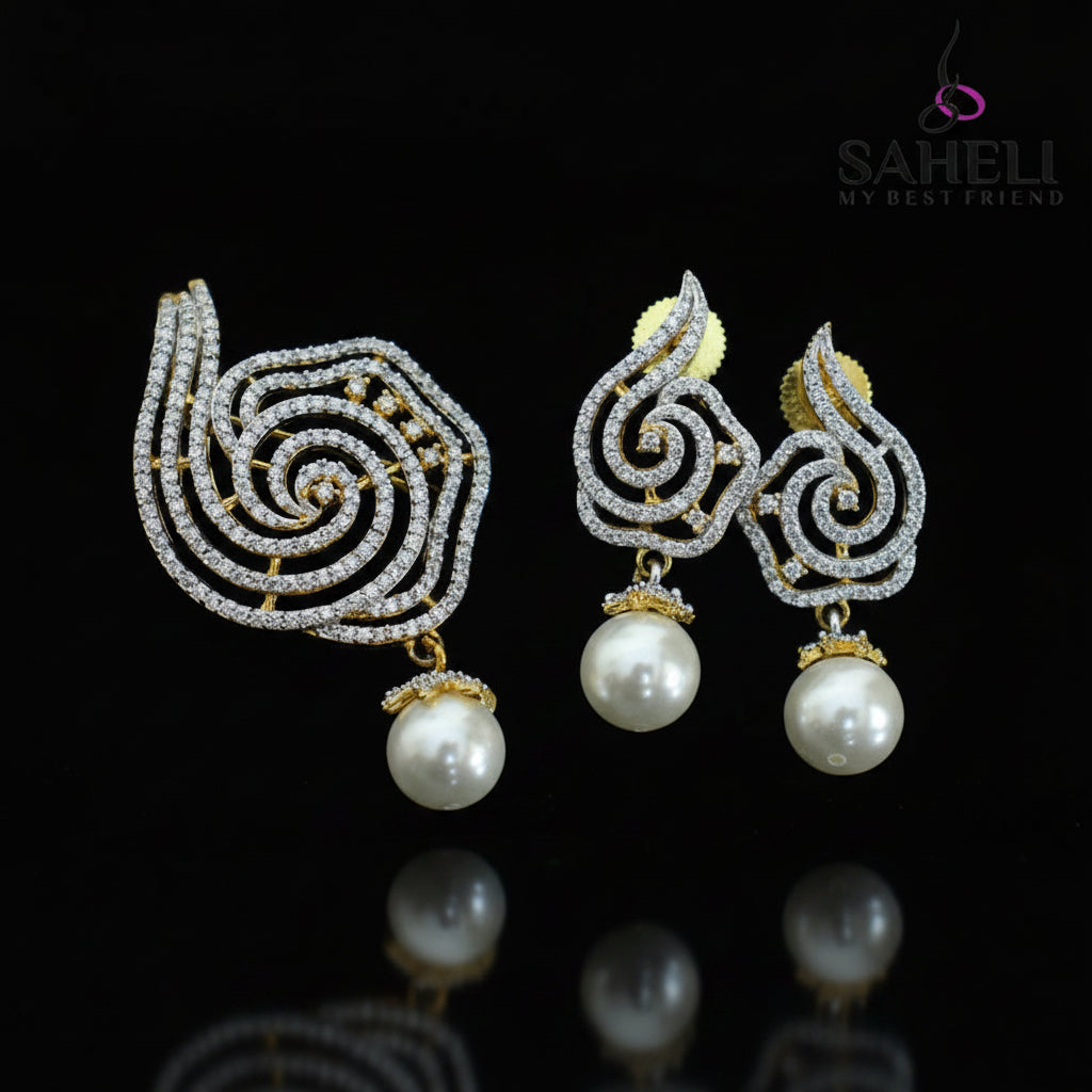 Ornate earrings with pearls on a dark background, featuring the brand 'Saheli'.