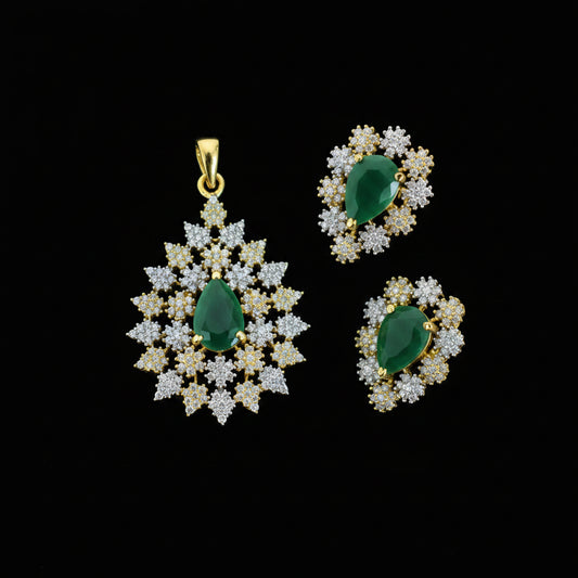 Jewelry set with green stones and gold accents on a dark background, featuring the brand 'Saheli'.