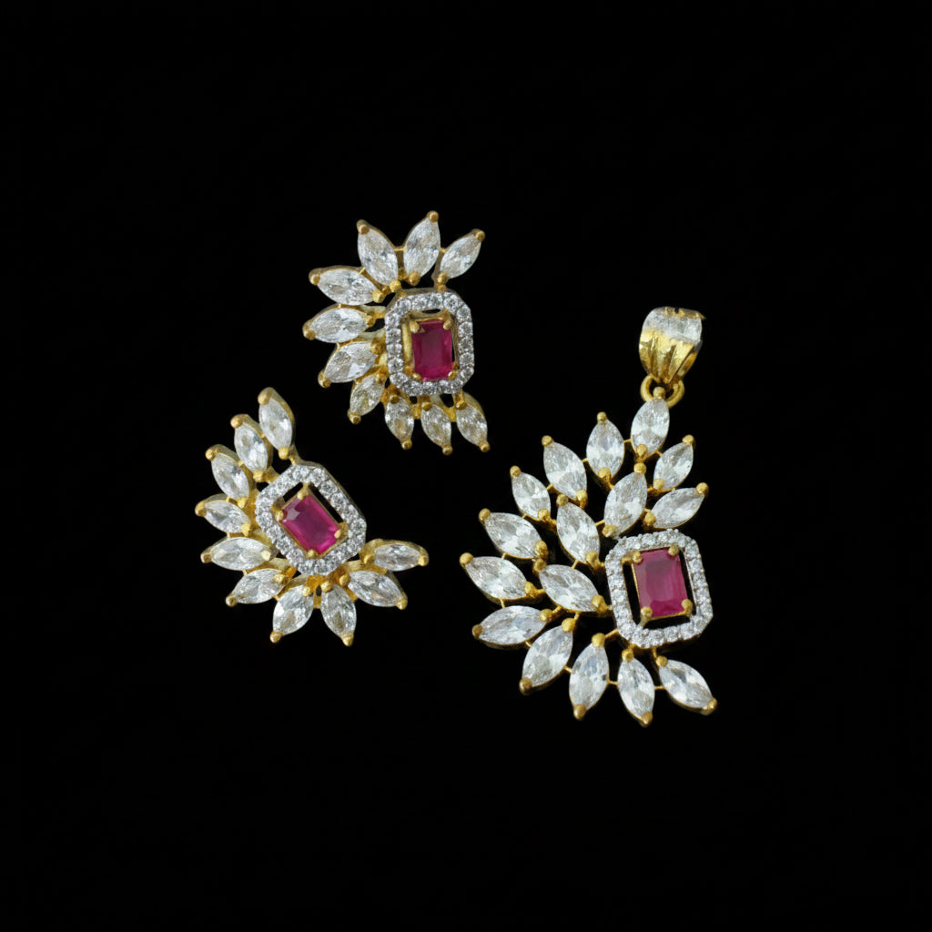 Gold and diamond jewelry set with red gemstones on a dark background, featuring the brand 'Saheli'.