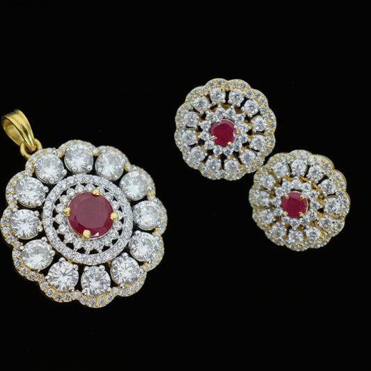 Gold and diamond earrings with red gemstones on a dark background, featuring the brand 'Saheli'.