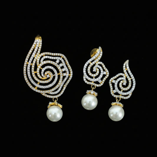 Ornate earrings with pearls on a dark background, featuring the brand 'Saheli'.