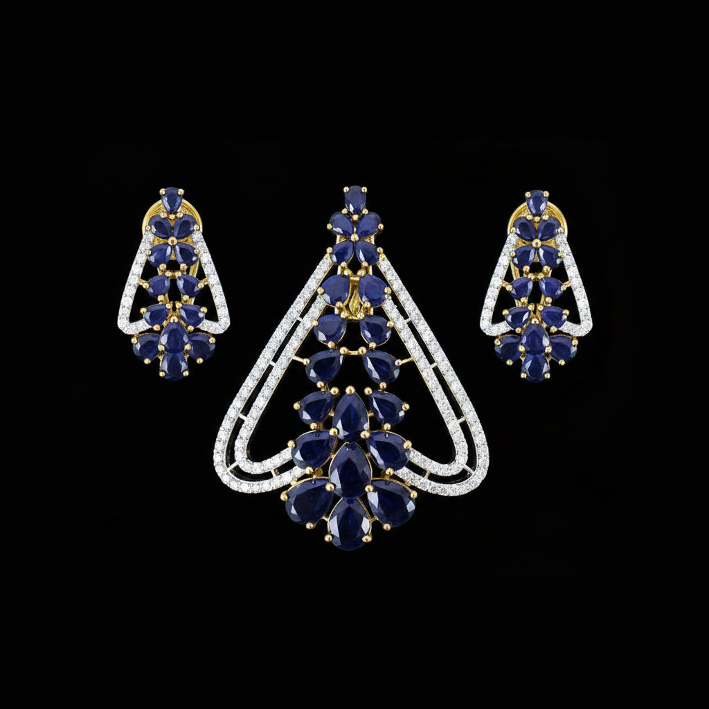 Pair of blue gemstone earrings with gold accents on a gray background, branded 'Saheili'.