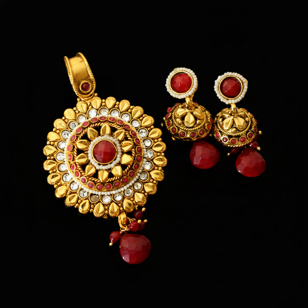Gold and red jewelry set with 'SAHELI' branding on a gray background