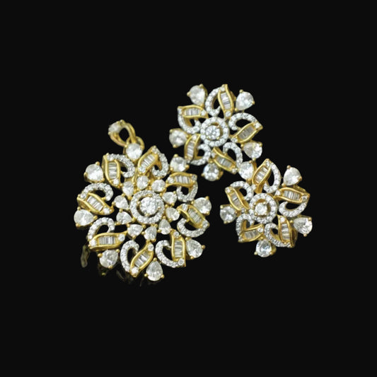 Gold and diamond earrings on a dark background with 'SAHELI' branding.