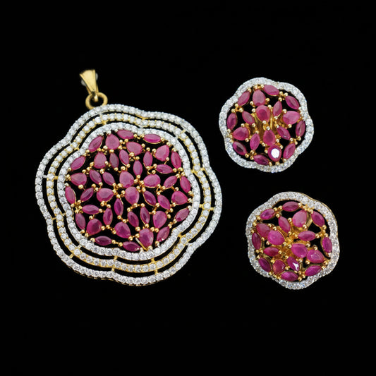 Jewelry set with pink gemstones and gold accents, branded 'Saheli'.