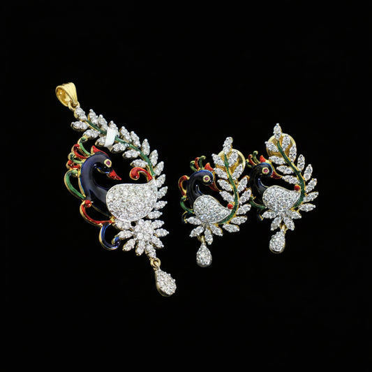 Ornate peacock-shaped earrings with gemstones on a dark background, featuring the brand 'SAHELI'.