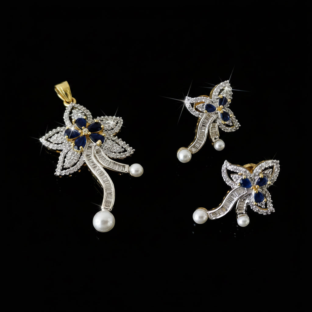 Butterfly-shaped jewelry set with pearls and gemstones on a dark background, featuring the brand 'Saheli'.