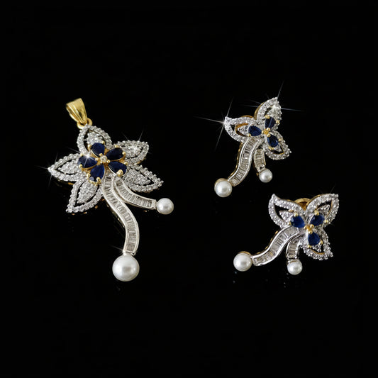Butterfly-shaped jewelry set with pearls and gemstones on a dark background, featuring the brand 'Saheli'.