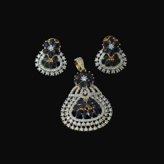 Jewelry set with pendant and earrings on a dark background, featuring the brand 'Saheli'.