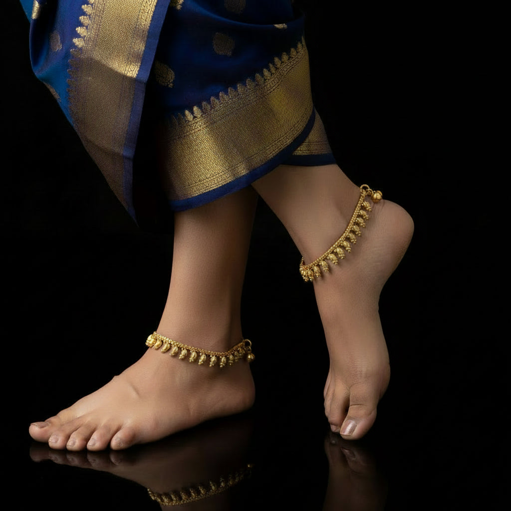Gold necklace on a dark background with 'SAHELI' branding.