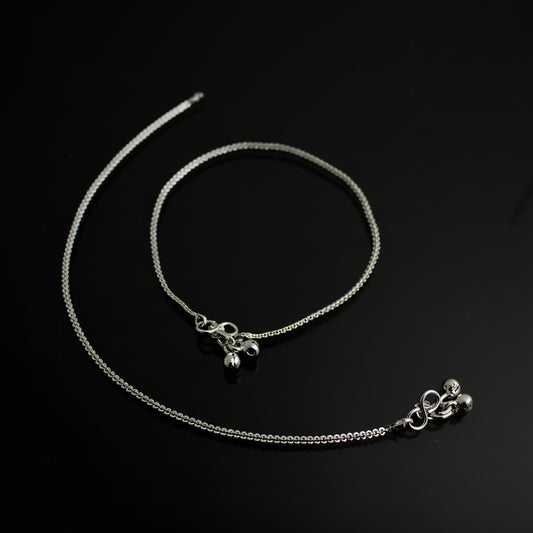 Silver necklace with pendant on a dark background