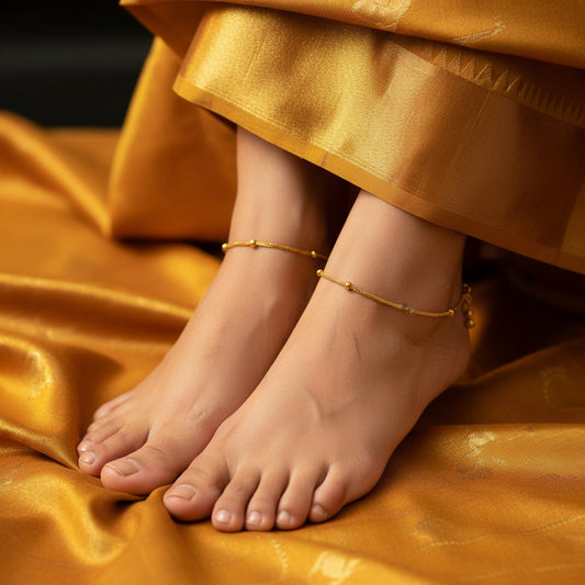 Gold anklet on a dark gray background