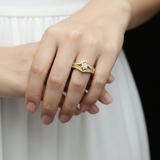 Gold ring with diamond on a gray background
