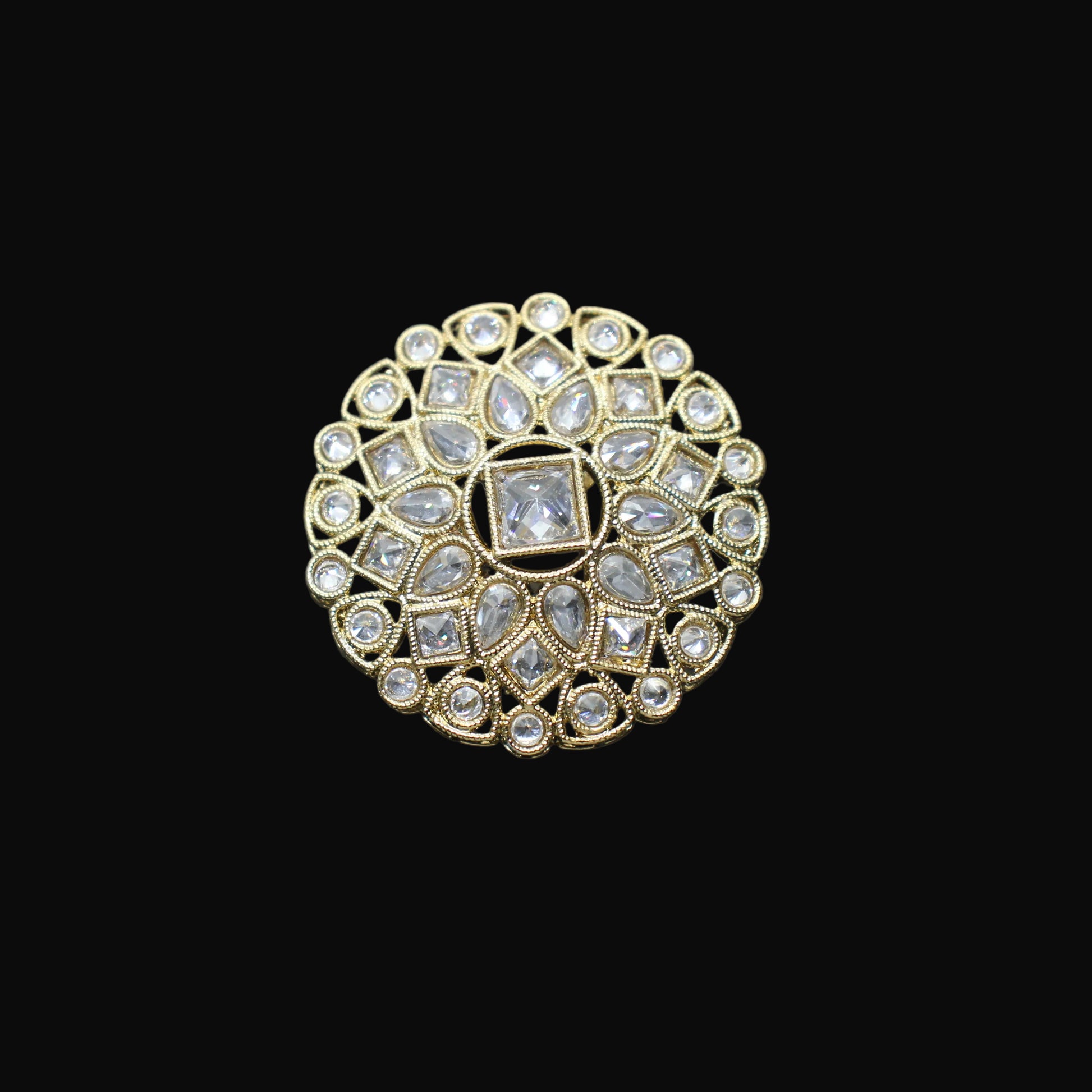 Decorative ring with gemstones on a black mannequin hand