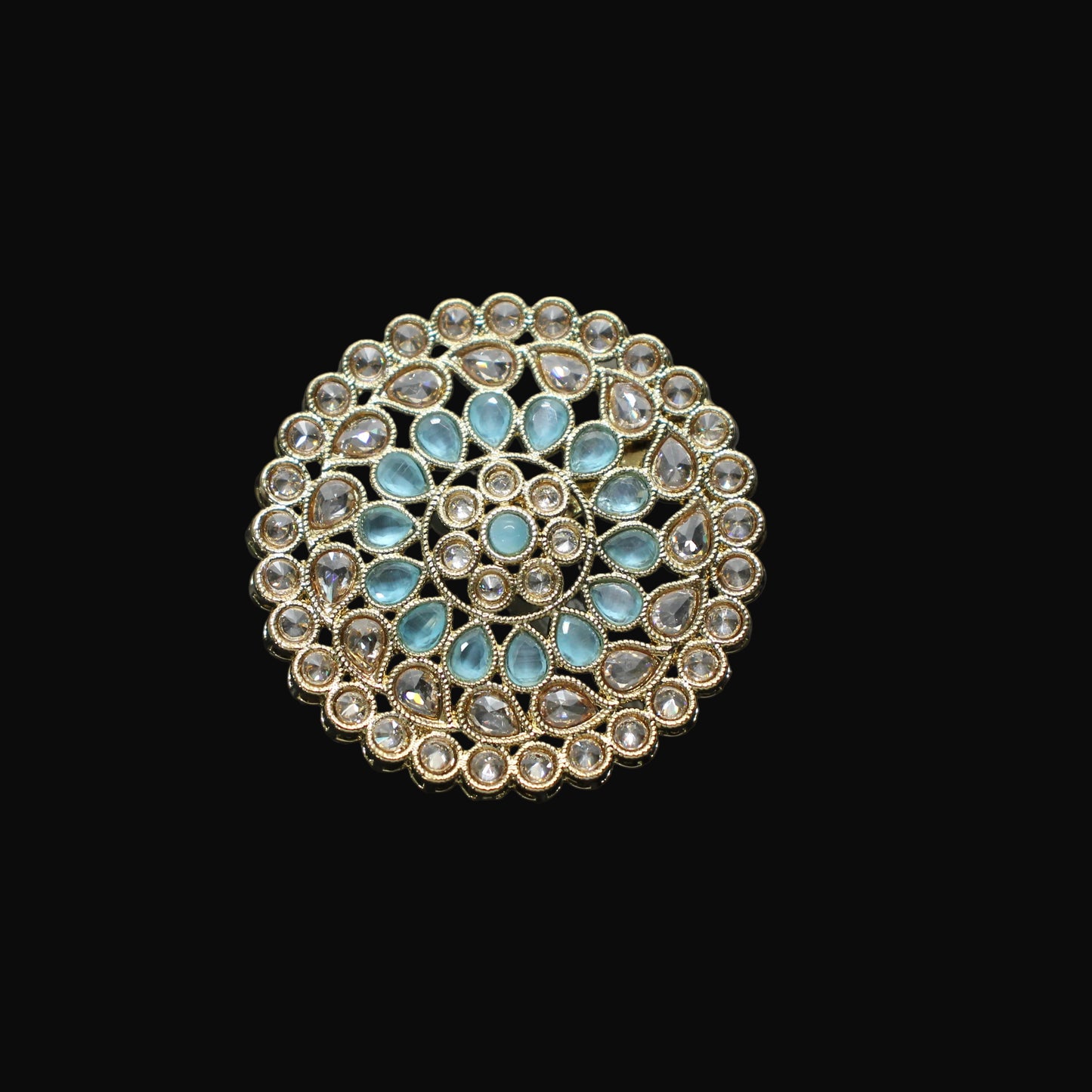 Jewelry ring with blue stones on a black mannequin hand