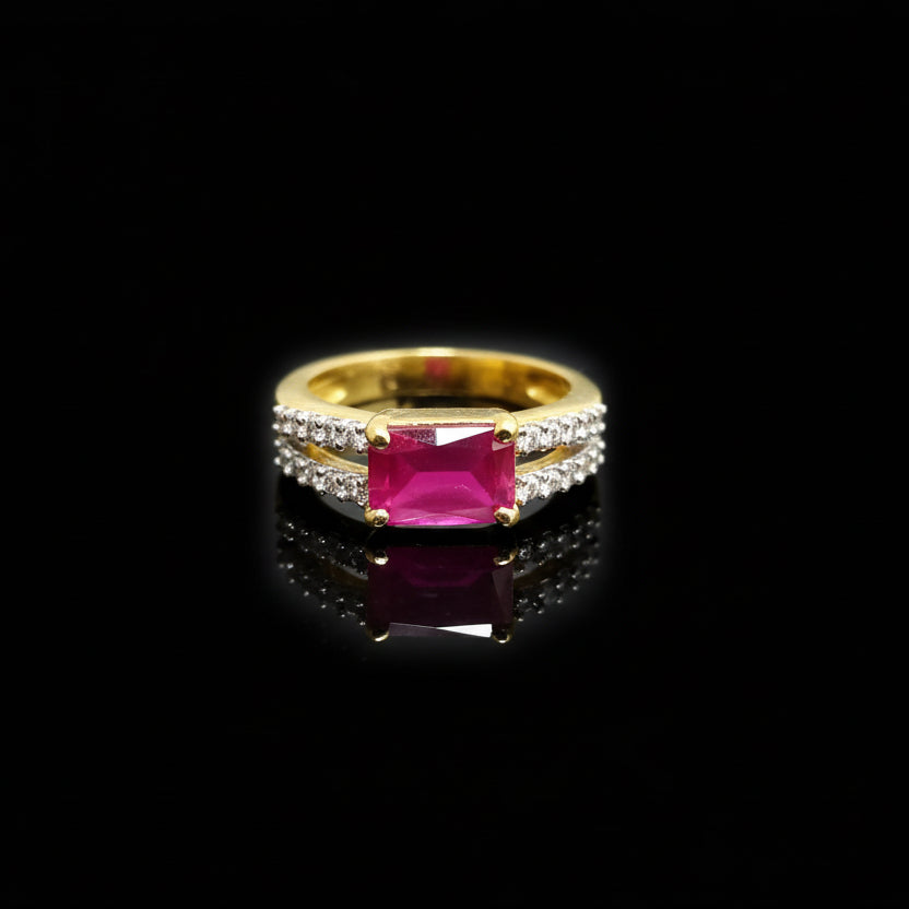 Gold ring with a pink gemstone on a gray background, branded 'Saheli'.