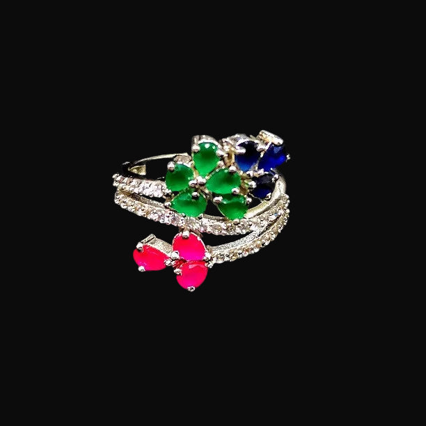 Multicolored gemstone ring with 'SAHELI' branding on a black background