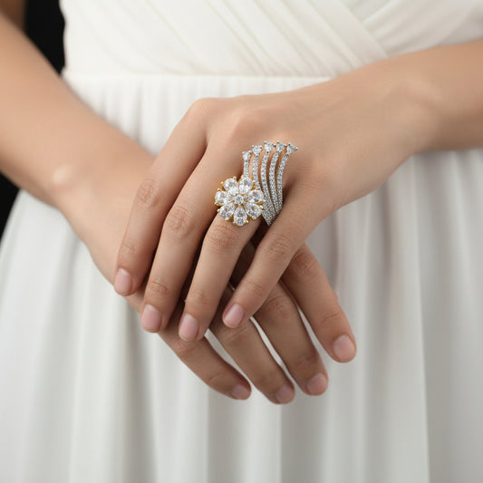 Gold and silver ring with diamonds on a gray background, featuring the brand 'SAHELLI'.