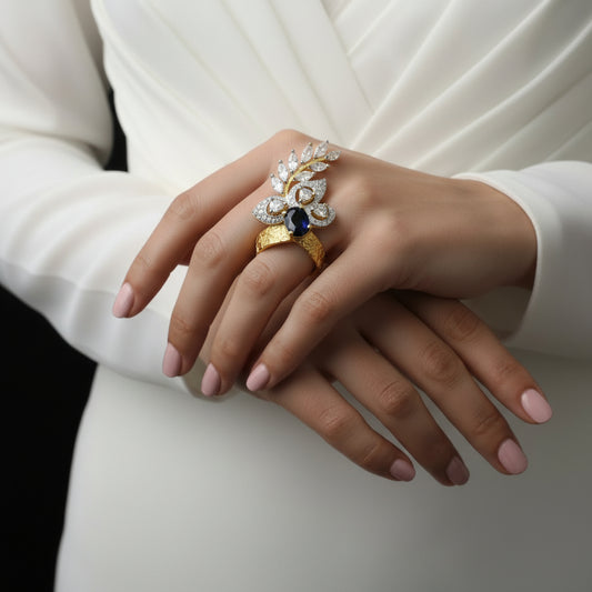 Gold ring with a blue gemstone on a gray background, featuring the brand 'Saheli My Best Friend'.