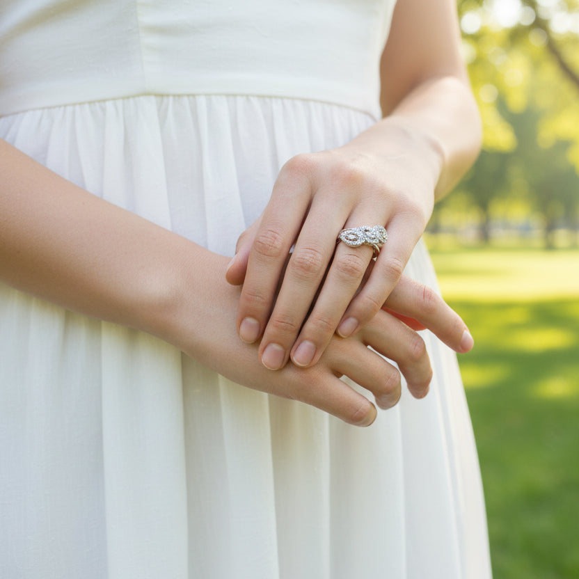Silver ring on a dark gray background with 'SAHELI' branding.