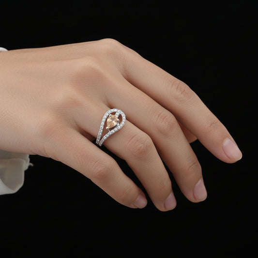 Diamond ring with a central yellow gemstone on a black background, featuring the brand 'Saheli'.