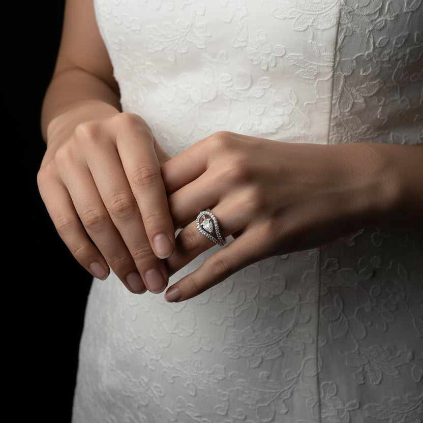 Silver brooch on a dark background with 'Saheli' branding.