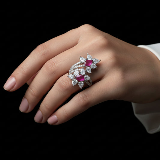 Jewelry with gemstones on a dark background, featuring the brand 'Saheili'.