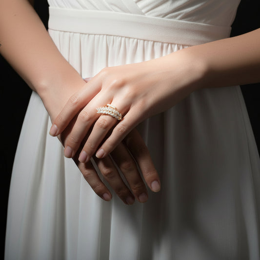 Gold and diamond ring on a black gloved hand with 'SAHELI' branding.