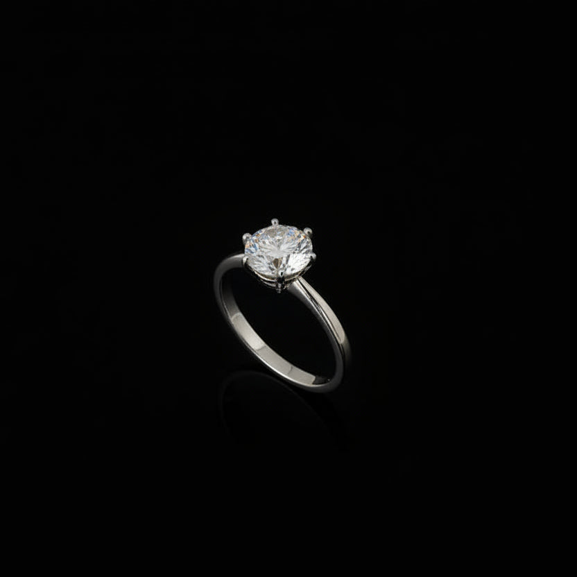 Silver ring with a large diamond on a black hand, brand 'Saheli' visible.