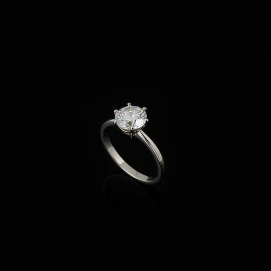Silver ring with a large diamond on a black hand, brand 'Saheli' visible.