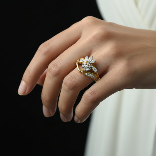 Two gold rings with diamonds on a black surface, branded 'Saheli'.
