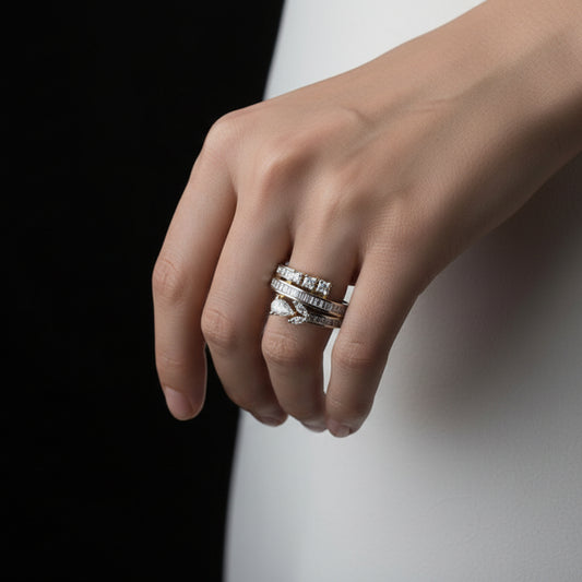 Gold ring with diamonds on a black mannequin hand, branded 'SAHELI'.