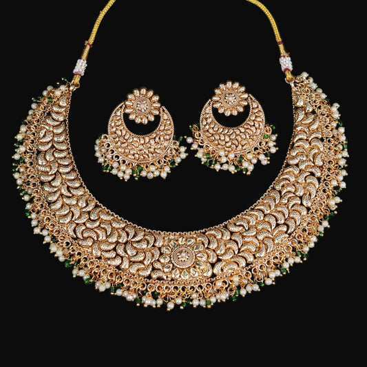 Gold necklace and earrings set with 'Saheli' branding on a dark background