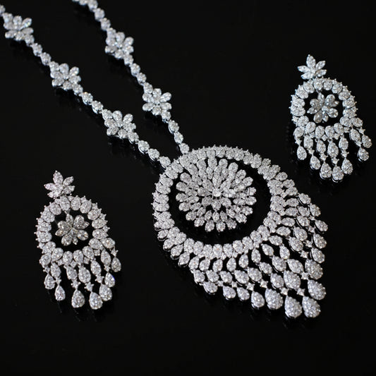 Diamond necklace and earrings set on a black background
