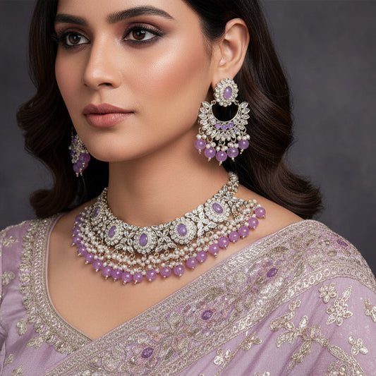 Jewelry set with purple stones on a black background, featuring the brand 'Saheli'.