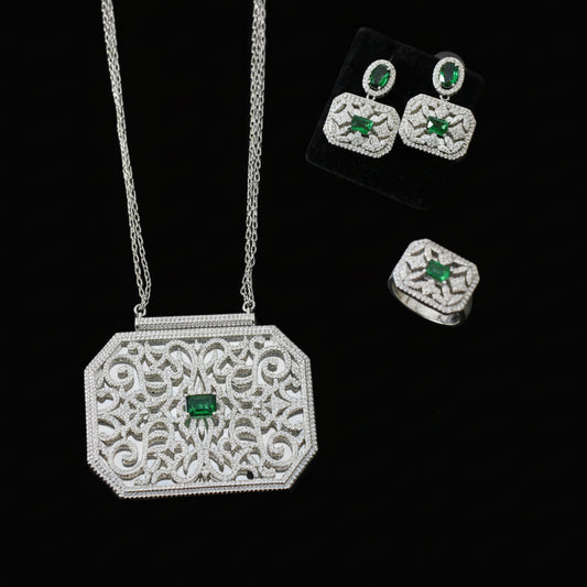 Jewelry set with necklace, earrings, and ring on a gray background