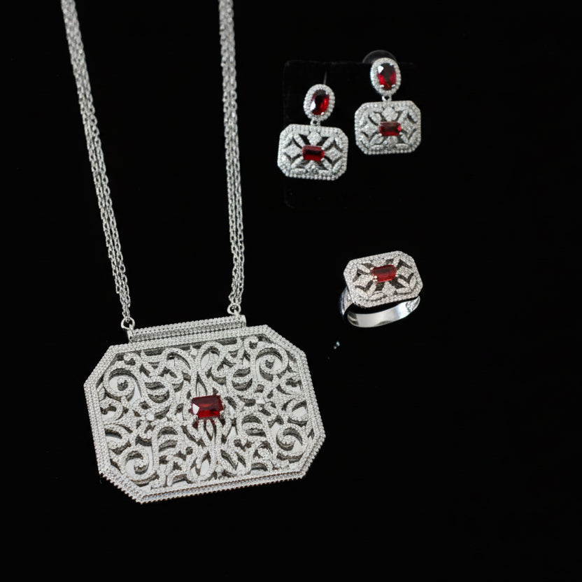 Jewelry set with necklace and earrings on a gray background
