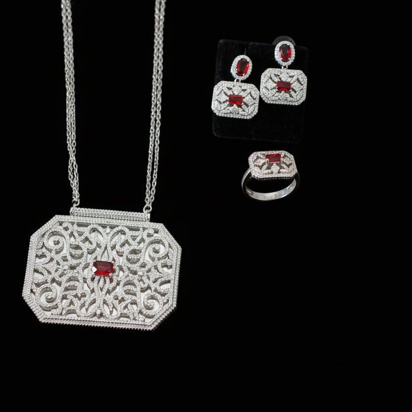Jewelry set with necklace and earrings on a gray background