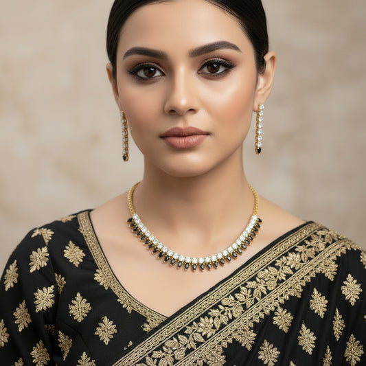 Gold and diamond necklace on a black background with 'SAHELI' branding.