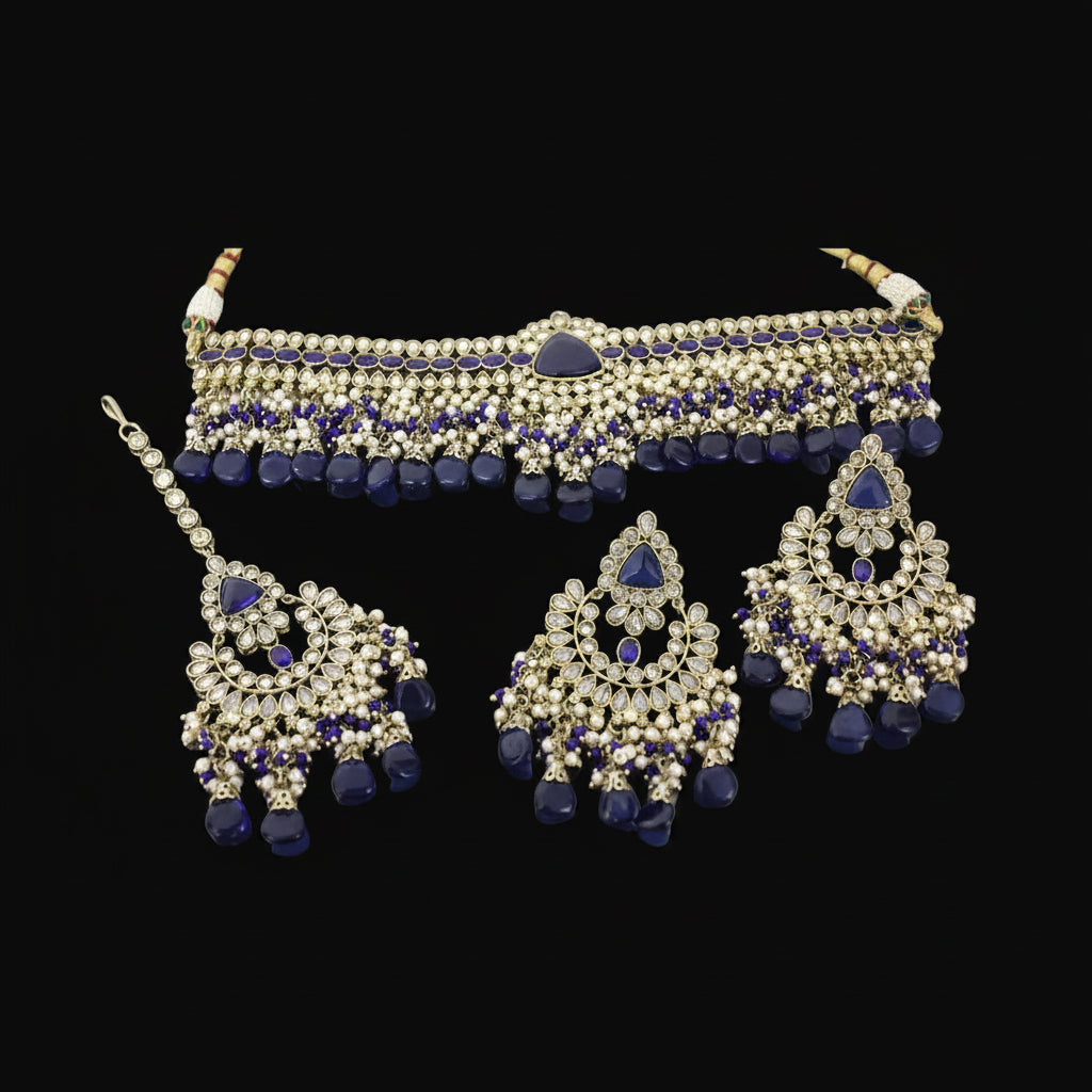 Jewelry set with necklace, earrings, and choker on a gray background