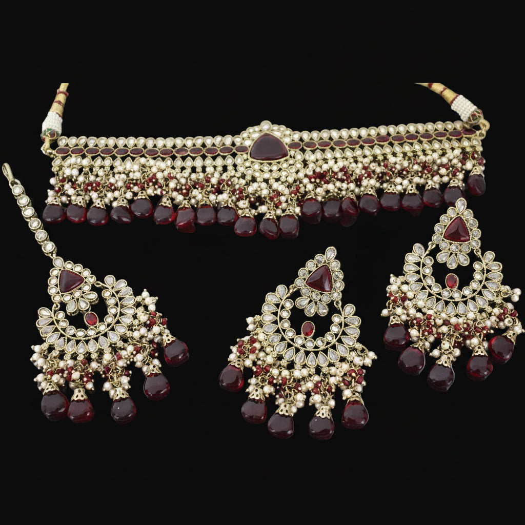 Jewelry set with necklace, earrings, and a headpiece on a dark background