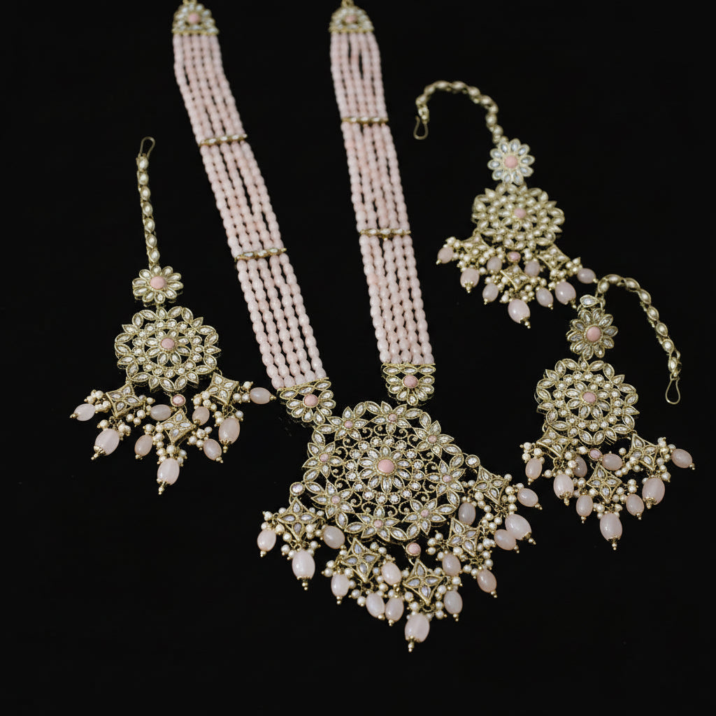 Ornate necklace with matching earrings on a dark background
