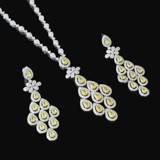 Diamond necklace and earrings set on a dark background