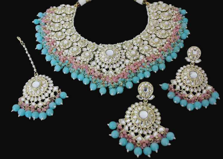 Jewelry set with necklace, earrings, and hairpin on a dark background